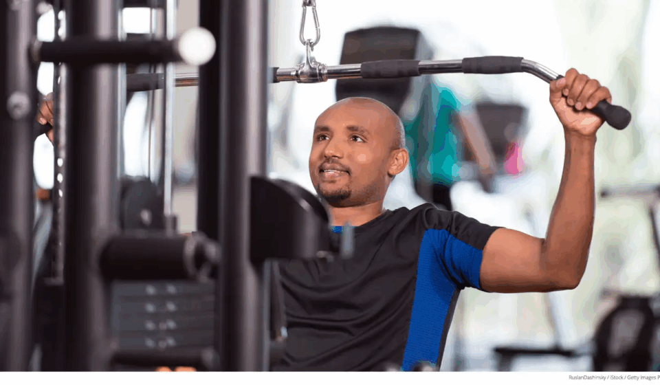 Man-exercising-on-weight-machine